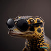 A cute gecko wearing black and gold detailed versace sunglasses